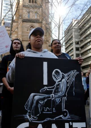 Demonstrators gather outside Sydney's Town Hall to protest against alleged child abuse in Australia's Northern Territory detention centers, July 30, 2016. REUTERS/Jason Reed