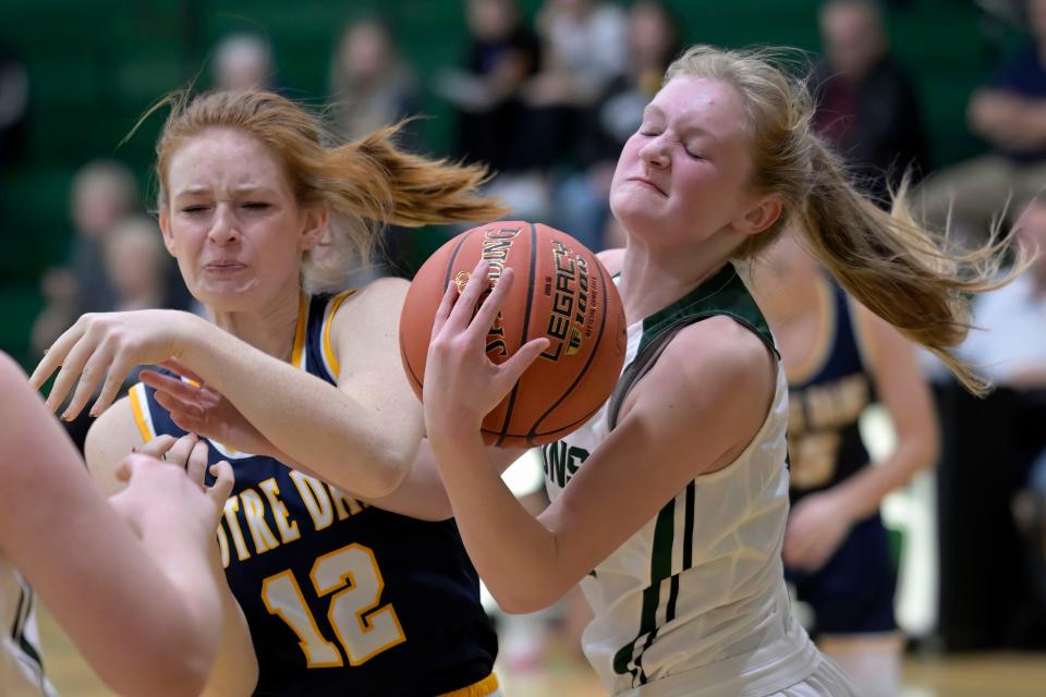 Notre Dame's  Abby Korschgen and West Burlington's Taryn Havener battle for a loose ball Tuesday at West Burlington.