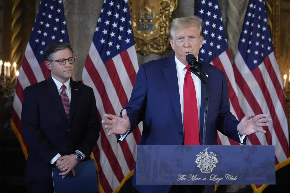 Republican presidential candidate former President Donald Trump speaks as Speaker of the House Mike Johnson, R-La., listens during a news conference, Friday, April 12, 2024, at Mar-a-Lago in Palm Beach, Fla. (AP Photo/Wilfredo Lee)