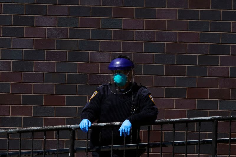 New York Hospital Police in protective equipment (PPE) outside Elmhurst Hospital during outbreak of coronavirus disease (COVID-19) in New York