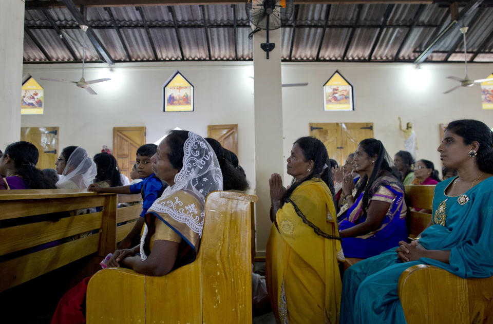 Catholics participate in Holy Mass at St. Joseph's church in Thannamunai, Sri Lanka, Tuesday, April 30, 2019. This small village in eastern Sri Lanka has held likely the first Mass since Catholic leaders closed all their churches for fear of more attacks after the Easter suicide bombings that killed over 250 people. (AP Photo/Gemunu Amarasinghe)