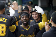 Pittsburgh Pirates' Andrew McCutchen celebrates in the dugout after hitting a home run against the Milwaukee Brewers during the first inning of a baseball game Tuesday, April 23, 2024, in Pittsburgh. (AP Photo/Matt Freed)