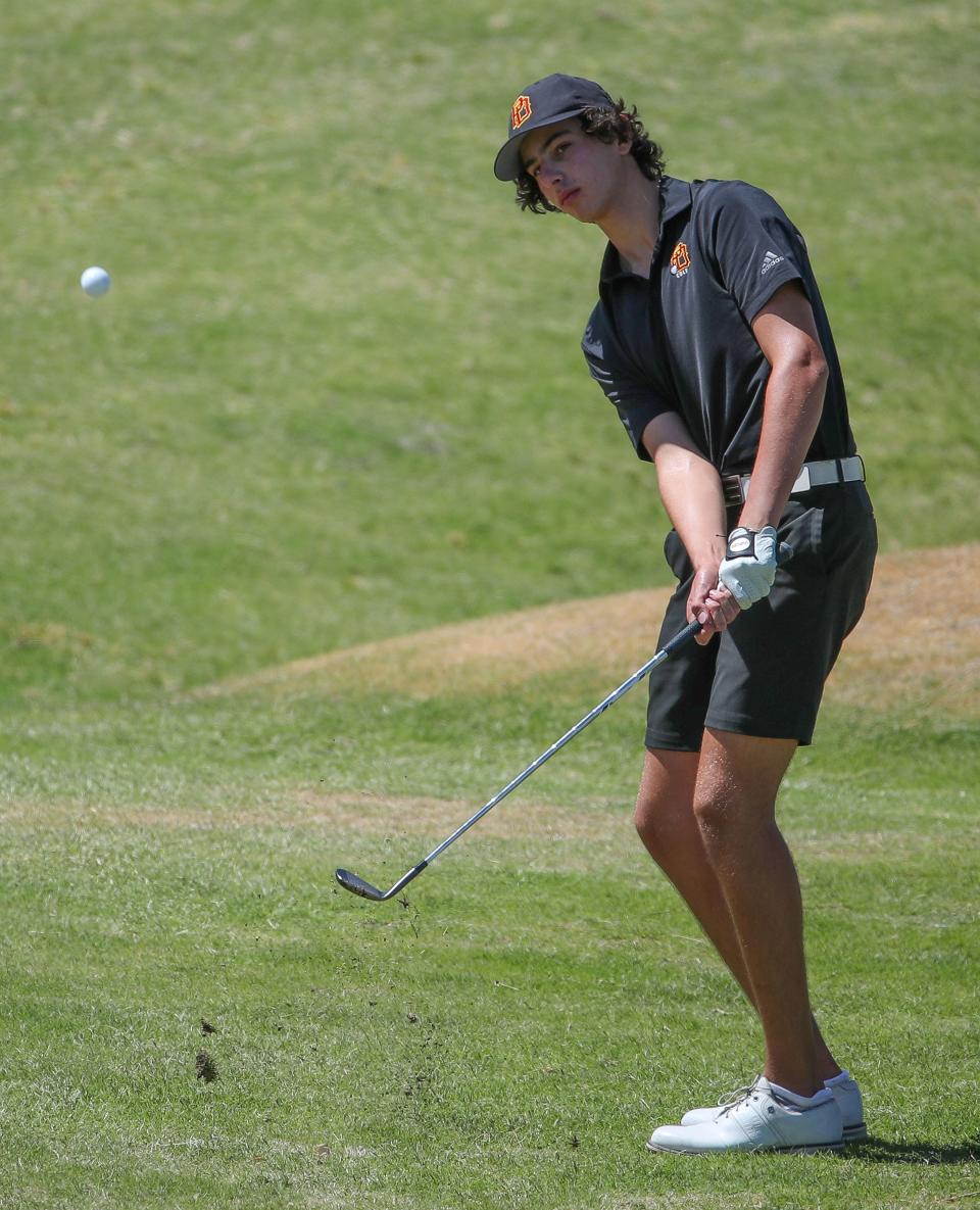 Max Margolis pitches to within a couple fee on the 7th hole to set up a birdie for Palm Desert High School during the Desert Empire League golf championships at the Mission Hills North Gary Player Signature Course in Rancho Mirage, Calif.,  May 3, 2023.