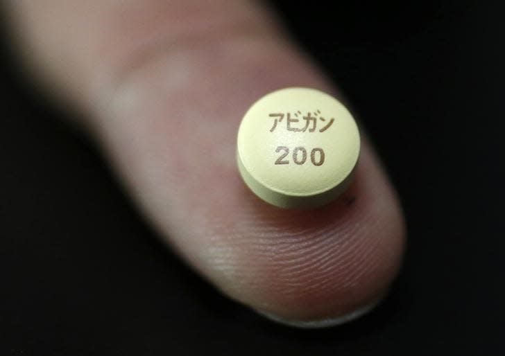 A tablet of Avigan (generic name : Favipiravir), a drug  approved as an anti-influenza drug in Japan and developed by drug maker Toyama Chemical Co, a subsidiary of Fujifilm Holdings Co. are displayed during a photo opportunity at Fujifilm's headquarters in Tokyo October 22, 2014.  REUTERS/Issei Kato