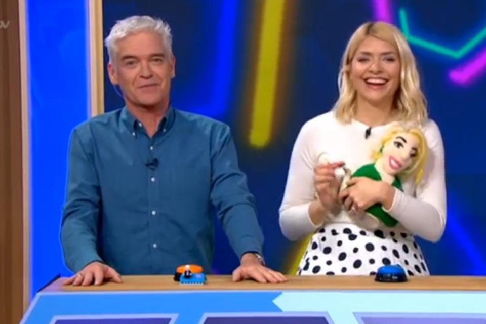 Prize: Holly Willoughby clutches her Holly Willoughby tea cosy (ITV)