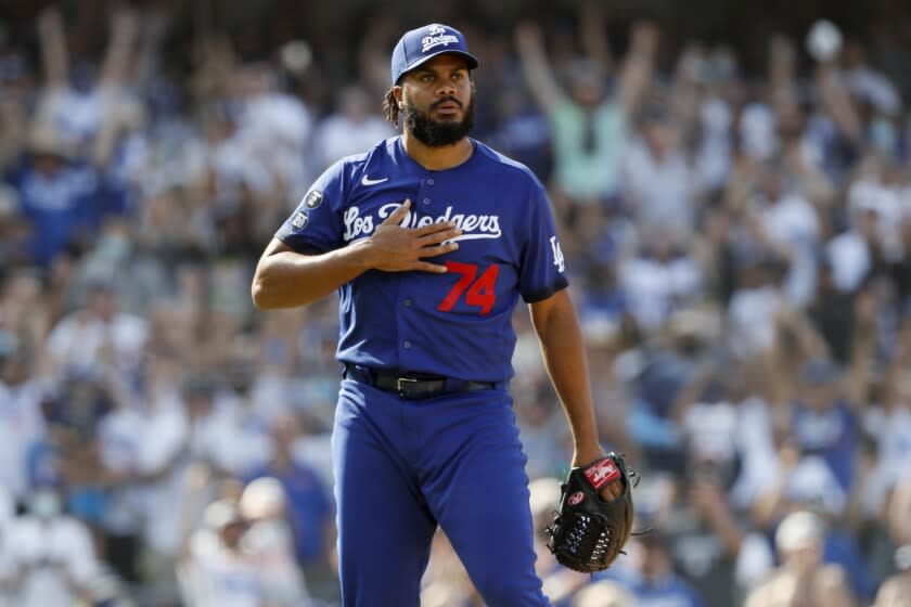 Los Angeles Dodgers relief pitcher Kenley Jansen reacts after striking.