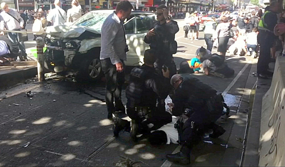 Gargasoulas is held down by police after mowing down pedestrians in the mall. Source: AP