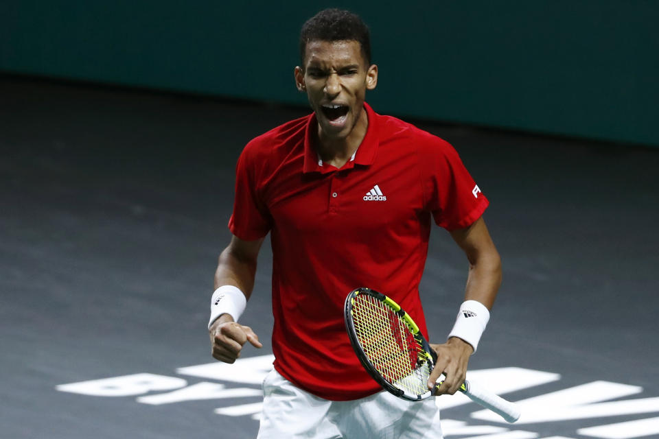 Canada's Felix Auger Aliassime reacts as he plays Australia's Alex de Minaur during the final Davis Cup tennis match between Australia and Canada in Malaga, Spain, Sunday, Nov. 27, 2022. (AP Photo/Joan Monfort)