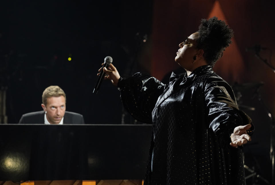 Brittany Howard, right, and Chris Martin perform together during the "In Memoriam" section of the 63rd Grammy Awards at the Los Angeles Convention Center, Tuesday, March 9, 2021. The awards show airs on March 14 with both live and prerecorded segments. (AP Photo/Chris Pizzello)