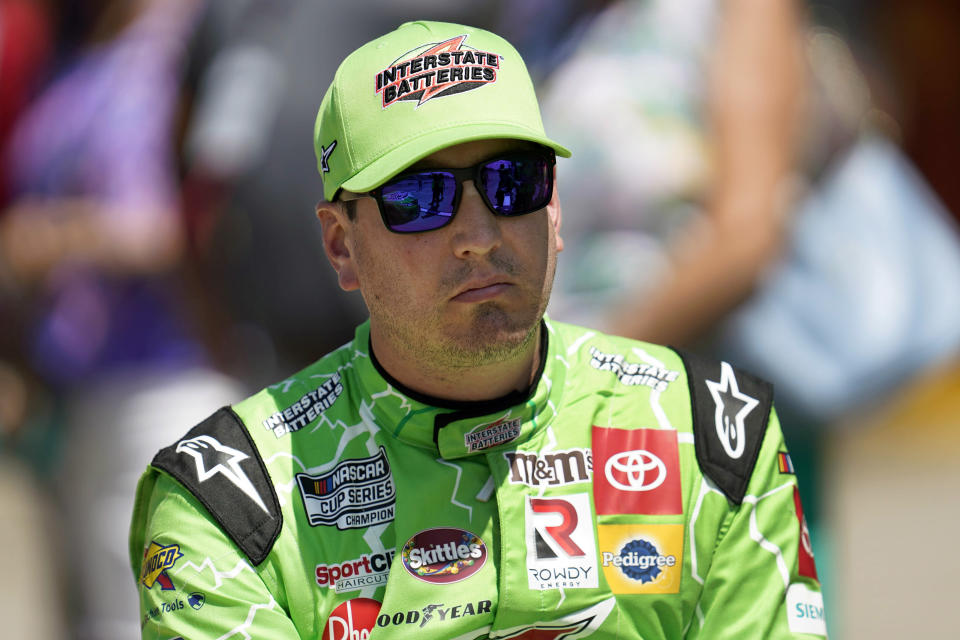 FILE - Kyle Busch watches during NASCAR Cup Series auto race qualifying at the Michigan International Speedway in Brooklyn, Mich., on Aug. 6, 2022. Busch, who was detained at a Mexican airport last month when a handgun was discovered in his luggage, was sentenced to 3½ years in prison and a $1,000 fine for having a gun and ammunition earlier this month by a judge in the Mexican state of Quintana Roo, home to beach destinations Cancun and Tulum. The federal Attorney General’s Office said that the judge decided to allow a conditional punishment and let Busch leave Mexico after he paid a bond. The office did not say how much he paid. (AP Photo/Paul Sancya, File)