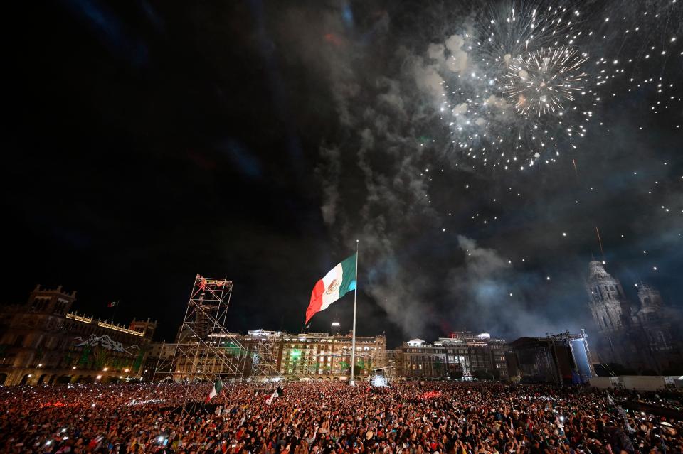 Fireworks are launched over the National Palace during the ceremony of "El Grito," marking the start of Independence Day celebrations in Mexico City on Sept. 15, 2022.