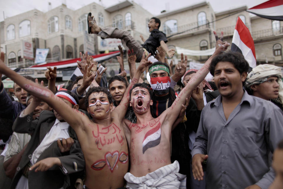 FILE - In this March 26, 2011 file photo, anti-government protestors react during a demonstration demanding the resignation of Yemeni President Ali Abdullah Saleh, in Sanaa, Yemen. Ten years ago, an uprising in Tunisia opened the way for a wave of popular revolts against authoritarian rulers across the Middle East known as the Arab Spring. For a brief window as leaders fell, it seemed the move toward greater democracy was irreversible. Instead, the region saw its most destructive decade of the modern era. Syria, Yemen, Libya and Iraq have been torn apart by wars, displacement and humanitarian crisis. (AP Photo/Muhammed Muheisen, File)