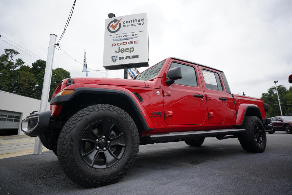 File - A used 2020 Jeep is on display on a lot in Pittsburgh, Thursday, Sept. 29, 2022. Price increases moderated in the United States last month, Thursday, Nov. 10, in the latest sign that the inflation pressures that have gripped the nation might be easing as the economy slows and consumers grow more cautious. (AP Photo/Gene J. Puskar, File)