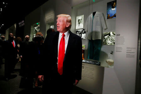 U.S. President Donald Trump pauses at the Dr. Ben Carson exhibit at the National Museum of African American History and Culture in Washington, U.S., February 21, 2017. REUTERS/Jonathan Ernst