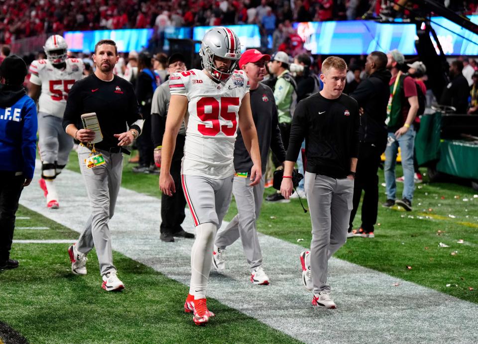 Dec 31, 2022; Atlanta, Georgia, USA; Ohio State Buckeyes place kicker Noah Ruggles (95) walks off the field after missing the game winning field goal against Georgia Bulldogs in the Peach Bowl in the College Football Playoff semifinal at Mercedes-Benz Stadium. 