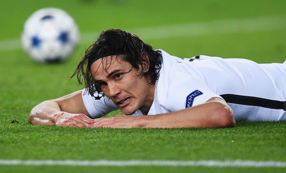 <p>Edinson Cavani of PSG reacts as his shot hits the post during the UEFA Champions League Round of 16 second leg match between FC Barcelona and Paris Saint-Germain at Camp Nou on March 8, 2017 in Barcelona, Spain. (Photo by Michael Regan/Getty Images) </p>