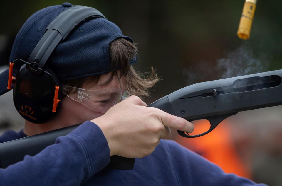 Richard Cooper, 12, closes his eyes as he shoots a clay target during a Hunter Safety Field Day at the Washtenaw Sportsman's Club in Ypsilanti on Saturday, Sept. 9, 2023.