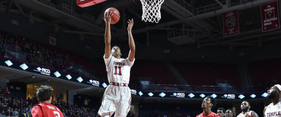 PHILADELPHIA - JANUARY 2: Temple Owls guard Trey Lowe (11) drives in for a lay-up during the American Athletic Conference basketball game January 2, 2016 in Philadelphia.