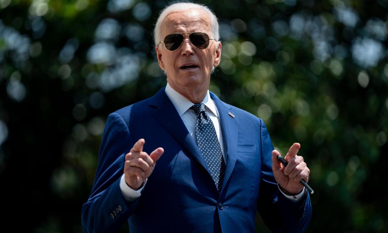 <span>President Joe Biden speaks to the press before boarding Marine One, on 29 July, in Washington.</span><span>Photograph: Bonnie Cash/Getty Images</span>