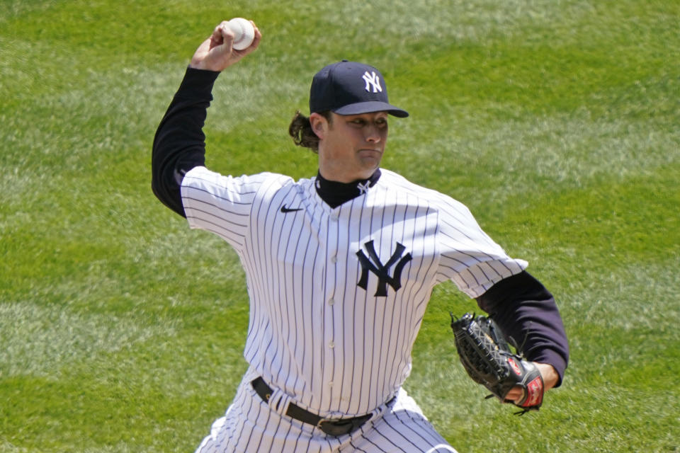 New York Yankees starting pitcher Gerrit Cole (45) winds up on a pitch during the first inning of a baseball game against the Tampa Bay Rays, Sunday, April 18, 2021, at Yankee Stadium in New York. (AP Photo/Kathy Willens)