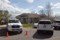 Authorities investigate a crime scene at a house in Pleasant Grove Utah, Sunday, April 13, 2014. According to the Pleasant Grove Police Department, seven dead infants were found in the former home of Megan Huntsman, 39. Huntsman was booked into jail on six counts of murder. (AP Photo/Daily Herald, Mark Johnston)