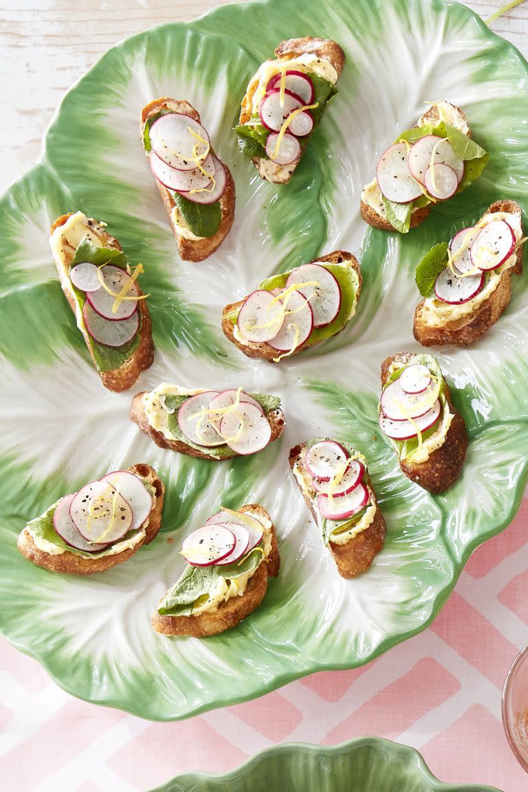 radish toasts arranged on a cabbage leaf shaped plate