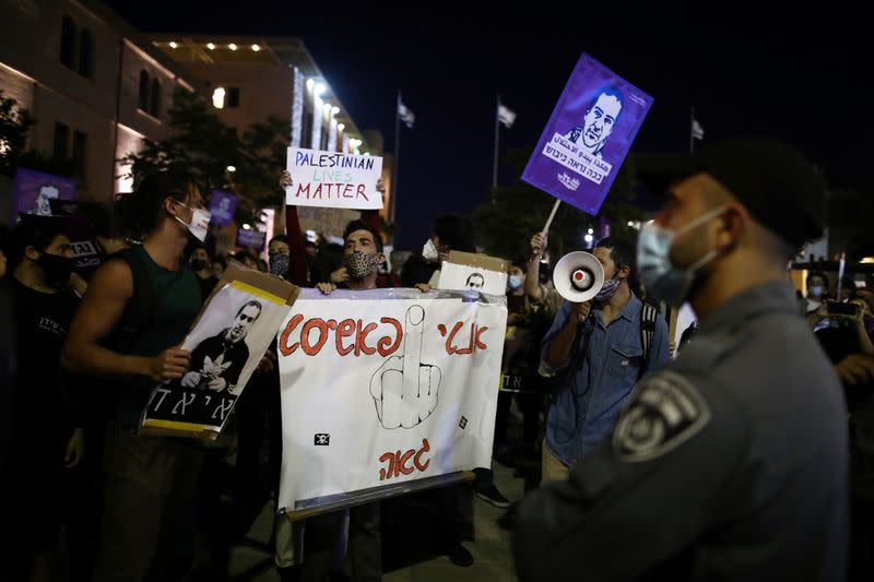 People take part in a demonstration against the aggression of Israeli forces against Palestinians, domestic violence, as well, to show solidarity with the Black Lives Matter movement, in Jerusalem