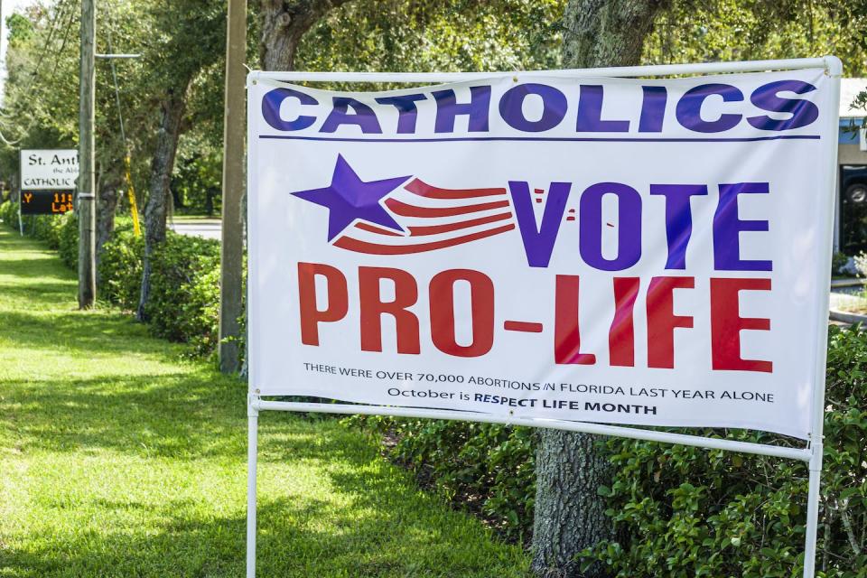 An anti-abortion message outside St. Anthony Church, in Brooksville, Fla., in 2020. <a href="https://www.gettyimages.com/detail/news-photo/florida-brooksville-st-anthony-church-catholics-vote-pro-news-photo/1280323701?adppopup=true" rel="nofollow noopener" target="_blank" data-ylk="slk:Jeffrey Greenberg/Education Images/Universal Images Group via Getty Images;elm:context_link;itc:0;sec:content-canvas" class="link ">Jeffrey Greenberg/Education Images/Universal Images Group via Getty Images</a>
