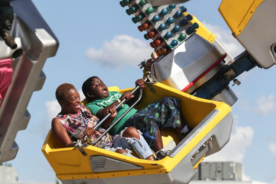 Sept. 2, 2018: Sharon Harris and her nephew Joduntis Robinson, 10, hold on while on a ride at the Delta Fair at the Agricenter