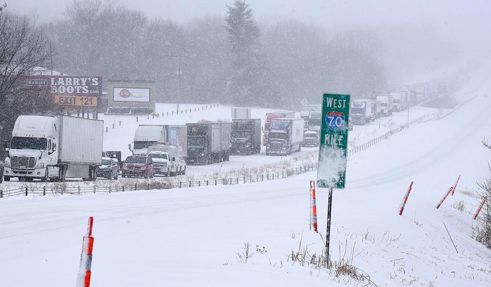 Eastbound Interstate 70 traffic near Stadium Boulevard is halted on Wednesday following several accidents after a winter storm dumped about 7 inches of snow, according to the National Weather Service. Forecasts called for another 4 to 7 inches of snow by the end of the storm Thursday.