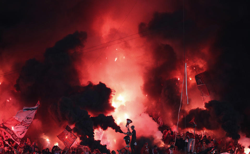 Olympiakos fans light flares