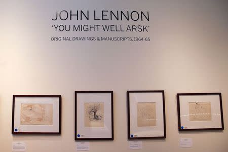 Drawings are seen as part of John Lennon's original drawings and manuscripts from 1964-65 at Sotheby's auction house in New York in this May 29, 2014 file photo. REUTERS/Shannon Stapleton