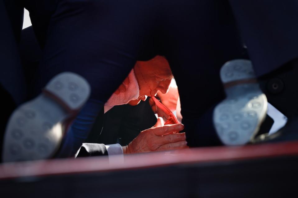 Moneymaker took this dramatic photo of Trump being tackled to the floor by Secret Service agents. Getty Images