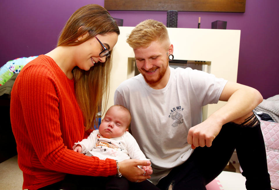 Parents Georgia and Tyler with daughter Piper-Kohl. [Photo: SWNS]