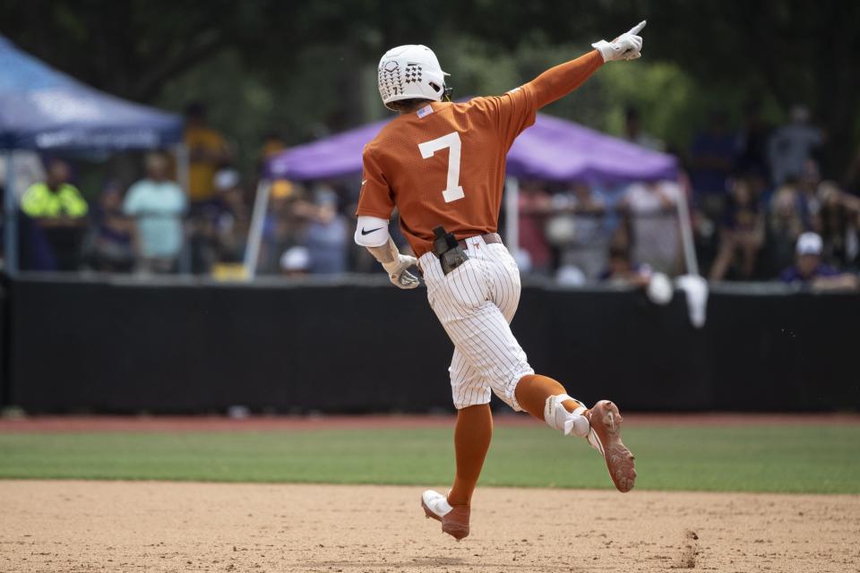 Texas' Douglas Hodo III points to the crowd after hitting a home run in the seventh inning of Saturday's 9-8 come-from-behind win over East Carolina in the Greenville Super Regional. The Longhorns have hit 128 homers this season.