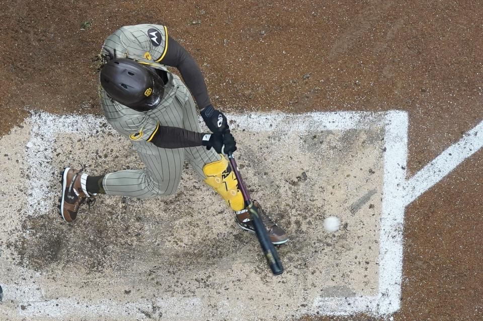 San Diego Padres' Fernando Tatis Jr. hirts a single during the fifth inning of a baseball game against the Milwaukee Brewers Tuesday, April 16, 2024, in Milwaukee. (AP Photo/Morry Gash)