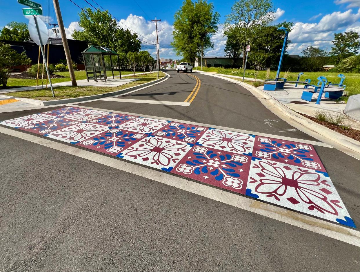 Columbia's new artistic crosswalk, located in the Columbia Arts District at the intersection of South Garden and Depot Streets, was recently unveiled. The crosswalk was designed and completed by local artist Whitney Herrington.