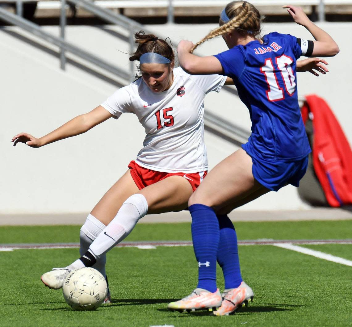 Argyle’s Sophie Placke tries to moves the soccer ball against Midlothian Heritage’s Lauren Schmidt in the second half of the Region 1-4A girls soccer final Saturday, April 9, 2022 at Northwest ISD Stadium in Justin Texas. Heritage went on to win 2-1. Special/Bob Haynes