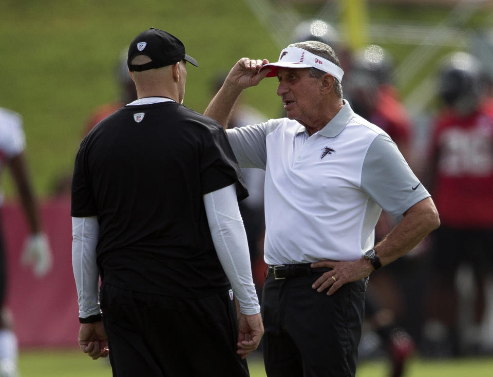 Atlanta Falcons owner Arthur Blank, right, talks with head coach Dan Quinn (AP Photo/John Bazemore)