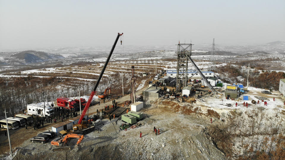 In this photo released by China's Xinhua News Agency, rescuers work at the site of a gold mine that suffered an explosion in Qixia in eastern China's Shandong Province, Wednesday, Jan. 13, 2021. Authorities have detained managers at a gold mine in eastern China where more than 20 workers have been trapped underground following an explosion Sunday. (Wang Kai/Xinhua via AP)
