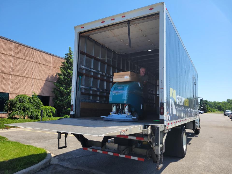 Tuesday morning saw multiple employees from Tennant Co. loading several industrial-sized floor scrubbers into a semi-truck.