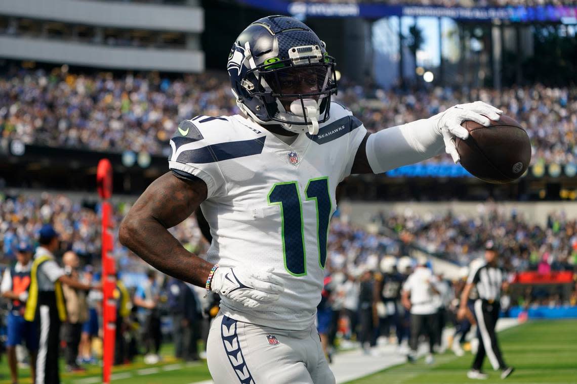 Seattle Seahawks wide receiver Marquise Goodwin (11) celebrates after scoring a touchdown during the first half of an NFL football game against the Los Angeles Chargers Sunday, Oct. 23, 2022, in Inglewood, Calif. (AP Photo/Marcio Jose Sanchez)