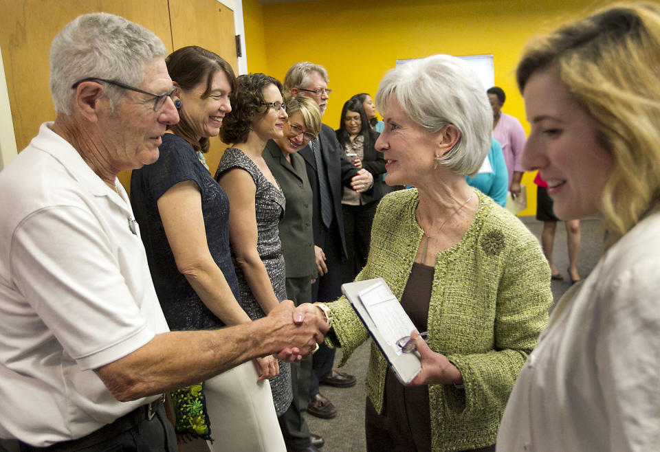 U.S. Secretary of Health and Human Services Kathleen Sebelius, talks with people during her visit to a call center at United Way of Greater Austin on Friday March 28, 2014, in Austin, Texas, to highlight local efforts to enroll consumers in affordable health coverage, just three days before the March 31 enrollment deadline. (AP Photo/Austin American-Statesman, Ralph Barrera)