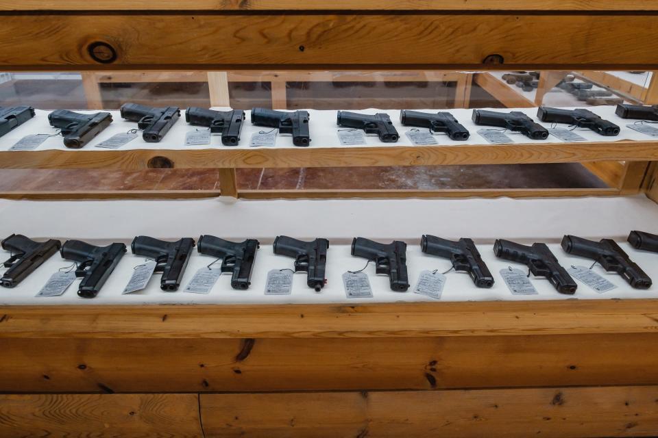 Glock pistols are displayed in a case at Bullzeye Tactical and Hunting in Roswell.