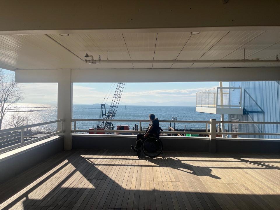 Owen Milne, executive director of the Community Sailing Center, looks out on the waterfront construction site from the Sailing Center's outdoor deck, as seen on Feb. 9, 2024.