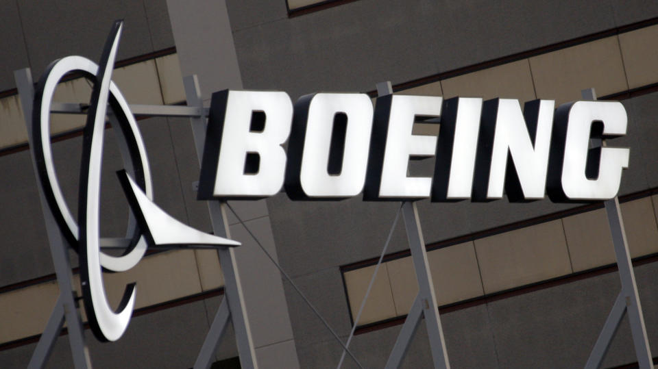 FILE - This Jan. 25, 2011, file photo, shows the Boeing Company logo on the property in El Segundo, Calif. Chicago-based aerospace giant Boeing has announced plans to build a new type of drone military aircraft in Australia. Boeing said Wednesday, Sept. 22, 2021 it has selected Toowoomba city in Queensland state as the final assembly point for its unmanned Loyal Wingman planes. The first test flights were completed earlier this year. (AP Photo/Reed Saxon, File)