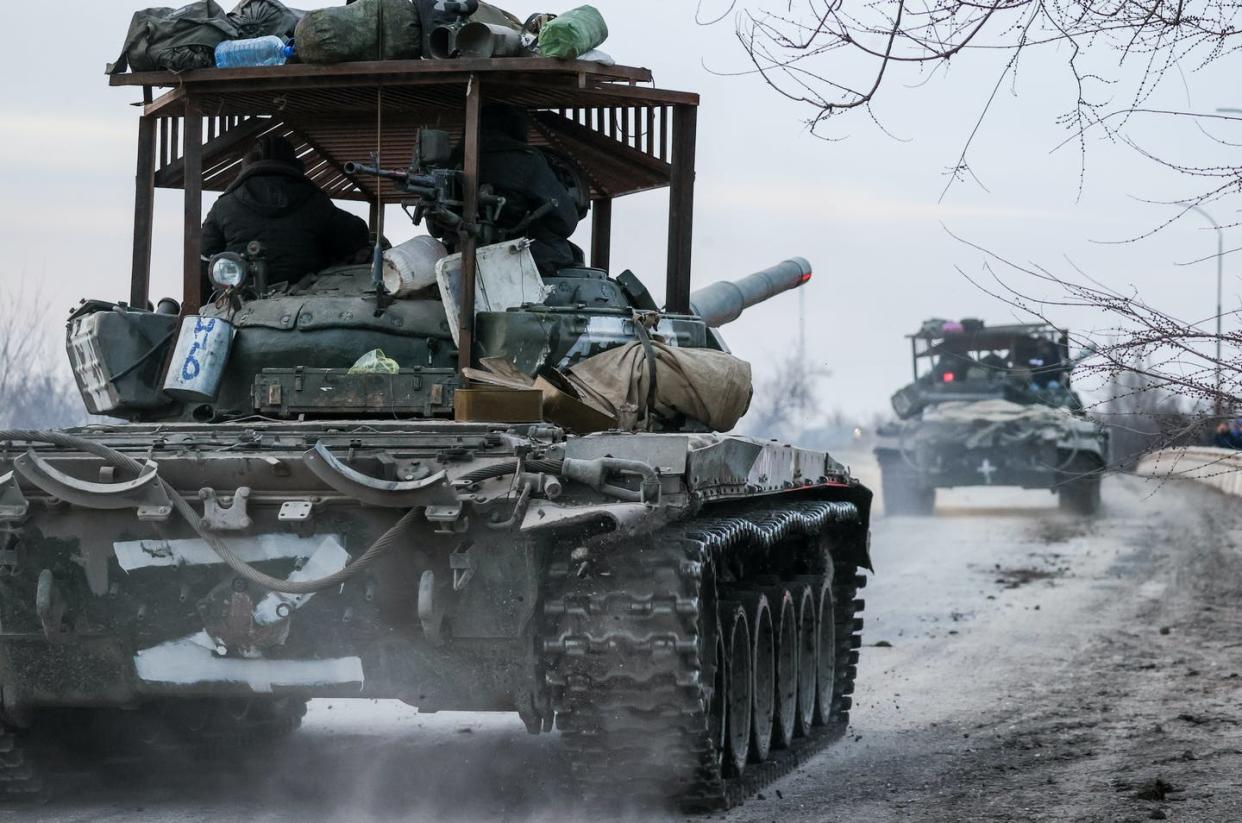 <span class="caption">On Feb. 24, Russian tanks moving into Ukraine. </span> <span class="attribution"><a class="link " href="https://www.gettyimages.com/detail/news-photo/tanks-move-across-the-town-of-armyansk-northern-crimea-news-photo/1238728359?adppopup=true" rel="nofollow noopener" target="_blank" data-ylk="slk:Sergei Malgavko\TASS via Getty Images);elm:context_link;itc:0;sec:content-canvas">Sergei Malgavko\TASS via Getty Images)</a></span>