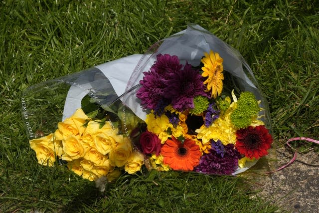 Floral tribute at the scene of a fatal house fire in Bradford.