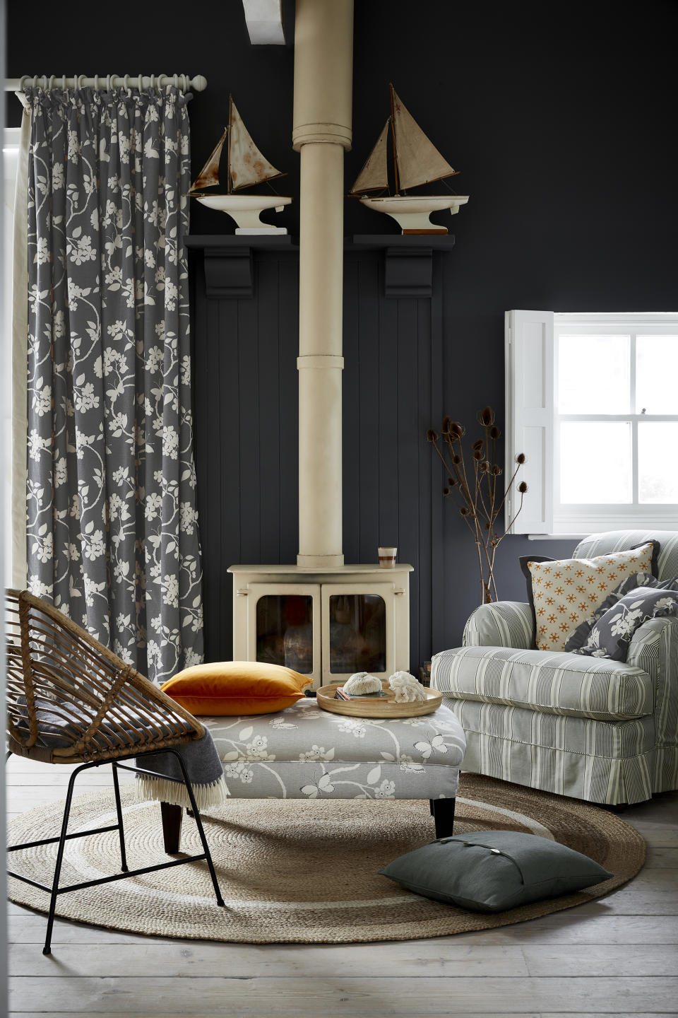 14. Temper dark walls with patterned curtains