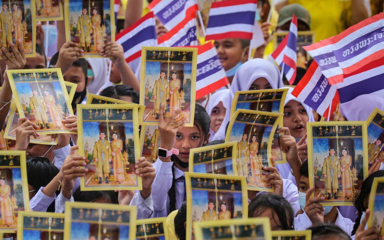 Students show support for the Thai royal establishment in a counter demonstration - TUWAEDANIYA MERINGING/AFP